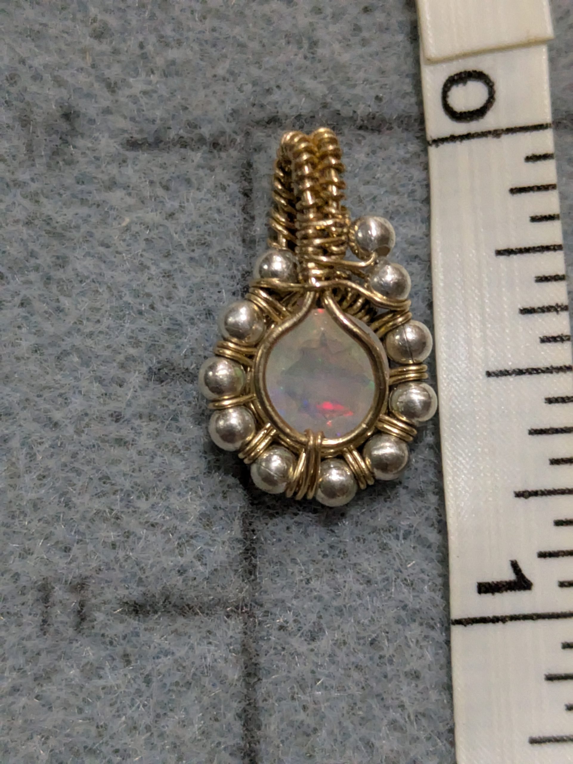 Sunlit Facet opal pendant showing size and side detail