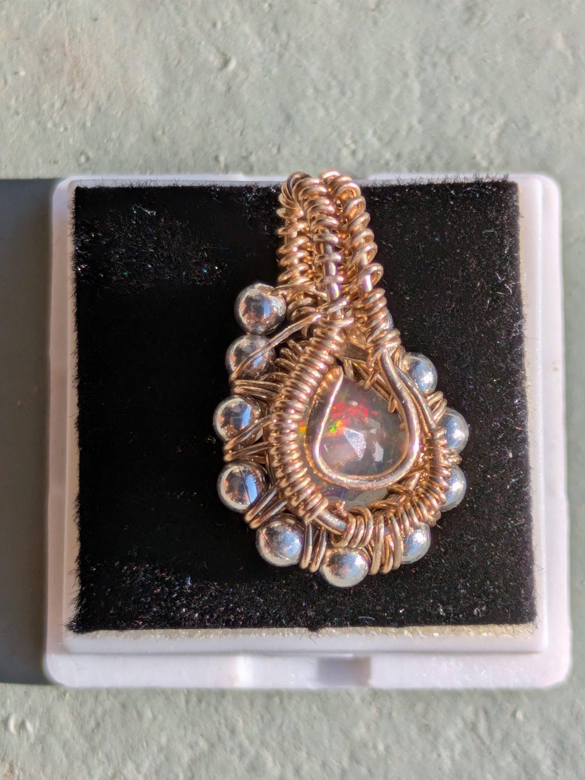 Sunlit Facet handmade faceted opal pendant, back view